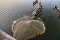 Mandalay, Myanmar - Nov 12, 2019: Fishermen near U Bein bridge in Amarapura