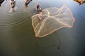 Mandalay, Myanmar - Nov 12, 2019: Fishermen near U Bein bridge in Amarapura