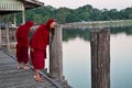 Mandalay, Myanmar - Nov 12, 2019: Monks at U Bein bridge in Amarapura