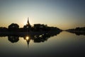 Mandalay Palace wall and moat picturesque silhouette with twilight sky in sunset with sun reflection in water Royalty Free Stock Photo