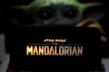 The Mandalorian logo smart phone that is a web television series. BABY YODA