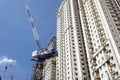 Mandaluyong, Philippines - A Luffing Jib Crane used to build a condominium tower in Metro Manila. Construction of Royalty Free Stock Photo