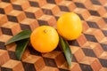 Mandarin with leaves on wooden cutting board Royalty Free Stock Photo