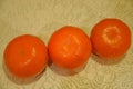 Three mandarins on white background, closeup.