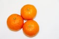 Three mandarins isolated on white background and space for your text.