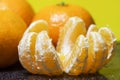 Mandarin orange fruit, peeled on a black background Royalty Free Stock Photo