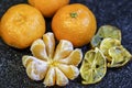 Mandarin orange fruit, peeled on a black background Royalty Free Stock Photo