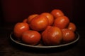 Mandarin oranges on plate dark backround