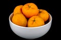 Mandarin Oranges in White Bowl on Black Background Royalty Free Stock Photo