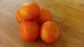 Mandarin oranges on the wood table Royalty Free Stock Photo