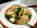 Mandarin Salad with Broccoli served with Plate and Fork at Restaurant.