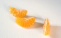 Mandarin slices on a light background Royalty Free Stock Photo
