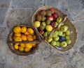 Mandarines and apples in a basket