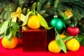 Mandarines next to Christmas tree