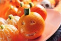 Mandarines ornamented as Halloween pumpkins Royalty Free Stock Photo