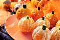 Mandarines ornamented as Halloween pumpkins Royalty Free Stock Photo