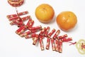 Mandarins and Fire Cracker Decoration Royalty Free Stock Photo