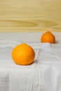 Mandarins. Minimalism. White tablecloth. Light background