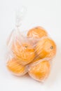 Mandarins in the polyethylene bag isolated Royalty Free Stock Photo