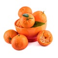 Mandarins tangerines composition in orange cup on white