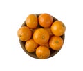 Mandarins in a wooden bowl with copy space for text. Ripe and tasty tangerines isolated on white. Clementines on a white backgroun Royalty Free Stock Photo
