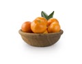 Mandarins in a wooden bowl with copy space for text. Ripe and tasty tangerines isolated on white. Royalty Free Stock Photo