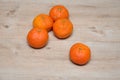 Mandarins on a wooden table with one in focus