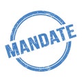 MANDATE text written on blue grungy round stamp