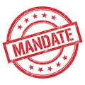 MANDATE text written on red vintage stamp