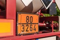 Orange dangerous goods sign on a truck Royalty Free Stock Photo