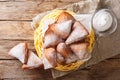 Mandazi, also known as theÃÂ daboÃÂ orÃÂ South Sudanese Coconut Doughnut close-up in a basket. Horizontal top view