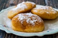 Mandazi is a slightly sweet East African Street Food; spicy, airy yeast doughnut dough made with coconut milk, flavored with Royalty Free Stock Photo