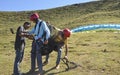 Mandi, Himachal Pradesh, India - 10 16 2021: Paragliders help to a tourist for adjusting parachute adjustment