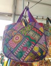 Photo of a amazing colorful Rajasthani artwork handbag hanging in the shop for sale