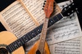 Mandolin and guitar with old blurred sheet music books Royalty Free Stock Photo