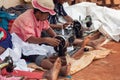 Street tailors work with their outdated manual sewing machines. Earn some money in Madagascar is very difficult