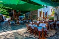 Mandraki, Greece, August 28, 2022: View of a tourist street in G