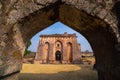 Mandu India, afghan ruins of islam kingdom, mosque monument and muslim tomb. View through door, Hindola Mahal. Royalty Free Stock Photo