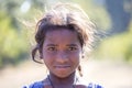 Portrait poor girl on the street in Indian village Mandu, India