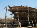 A wooden dhow ship under construction at the ship building yard in the coastal town of