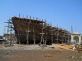 A wooden dhow ship under construction at the ship building yard in the coastal town of