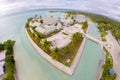Maneaba ni Maungatabu Parliament of Kiribati building on motu in an atoll's lagoon, aerial view. House of Assembly, Tarawa.