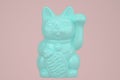 Maneki Neko, Lucky Cat isolated on pink background. 3D illustration