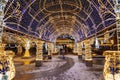 Manezhnaya square during New Year and Christmas holidays with glowing multi-colored arch, Moscow,