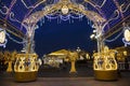 Manezhnaya square during New Year and Christmas holidays with glowing multi-colored arch, Moscow,