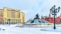 Manezhnaya Square during snowfall in winter Moscow, Russia. Panorama of the Moscow city center under snow