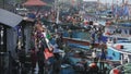 MANGALORE, INDIA -2011: Fishermen transferring fish catch from sea to trucks on October