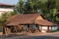 An old rustic house with classic sloping tiled roofs in a village