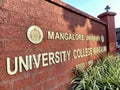 The sign at the entrance to the Mangalore University College building in the city Royalty Free Stock Photo