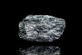 Manganese ore, raw rock on black background, mining and geology